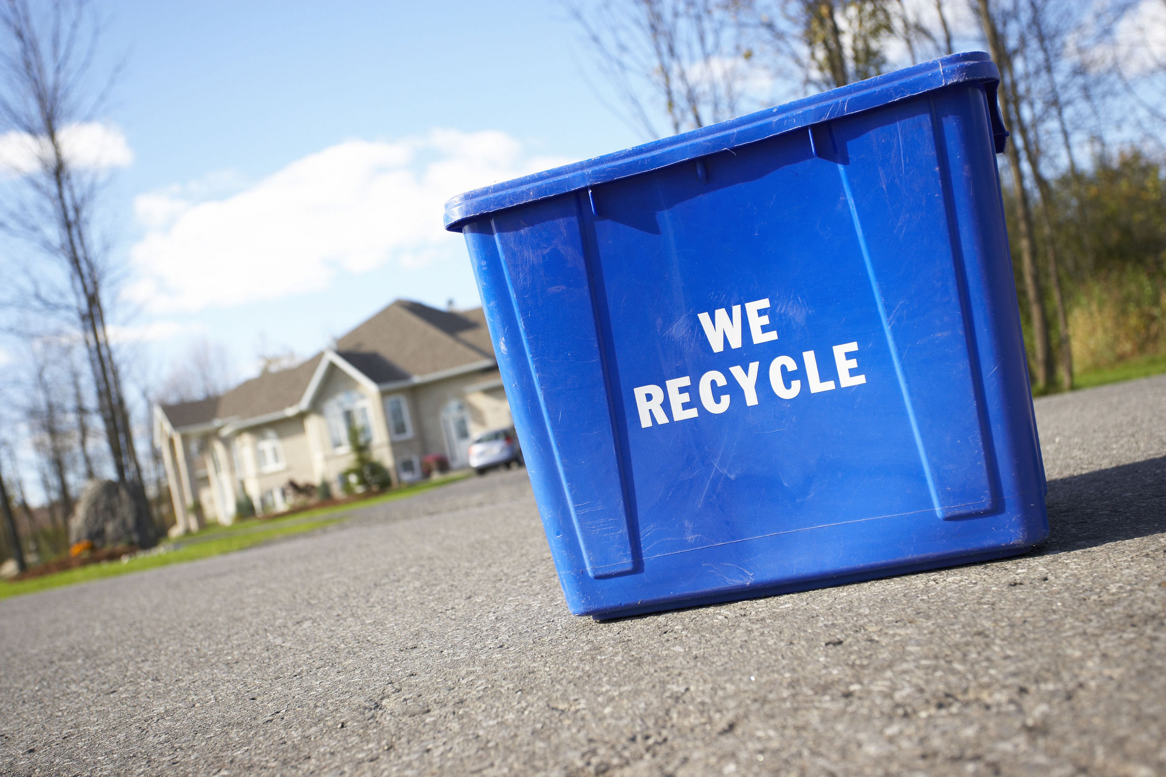 Recycle bin on roud outside of home.